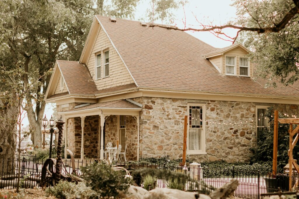 Historical Cobble Stone Wedding Venue with Greenery & Lights | Mill Pond Farms Wedding Venue | Stansbury Lake, Utah | Barn Wedding Venues in Utah | Small Affordable Wedding Venue