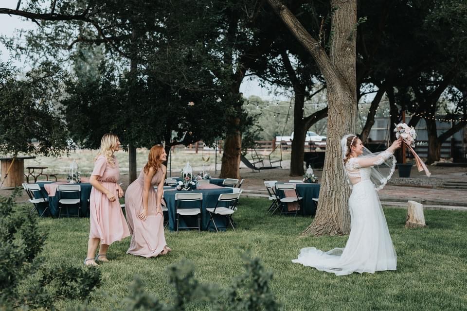 Bride Throwing Bouquet Outdoors | 6 Reasons Why Mill Pond Farms Event Center is Utah's Best Outdoor Wedding Venue | Mill Pond Farms | Rustic Outdoor Wedding in Utah