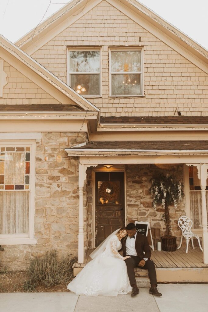 Bridal Couple Sitting Together on Porch | Why Choosing a Wedding Venue with an Indoor and Outdoor Area Is Essential | Mill Pond Farms | Outdoor vs Indoor Wedding