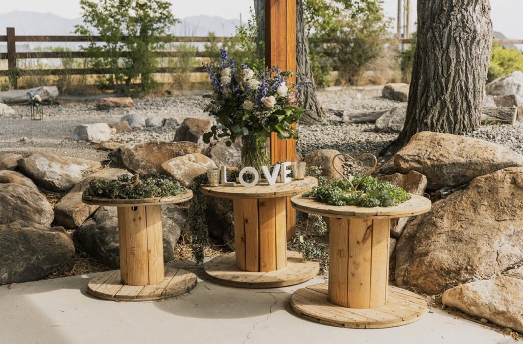 3 Wooden Spools with Rustic Wedding Decor | Choosing Your Perfect Wedding Venue in Utah | Mill Pond Farms | Choosing a Rustic Wedding Venue in Utah | Best Wedding Venues in Utah
