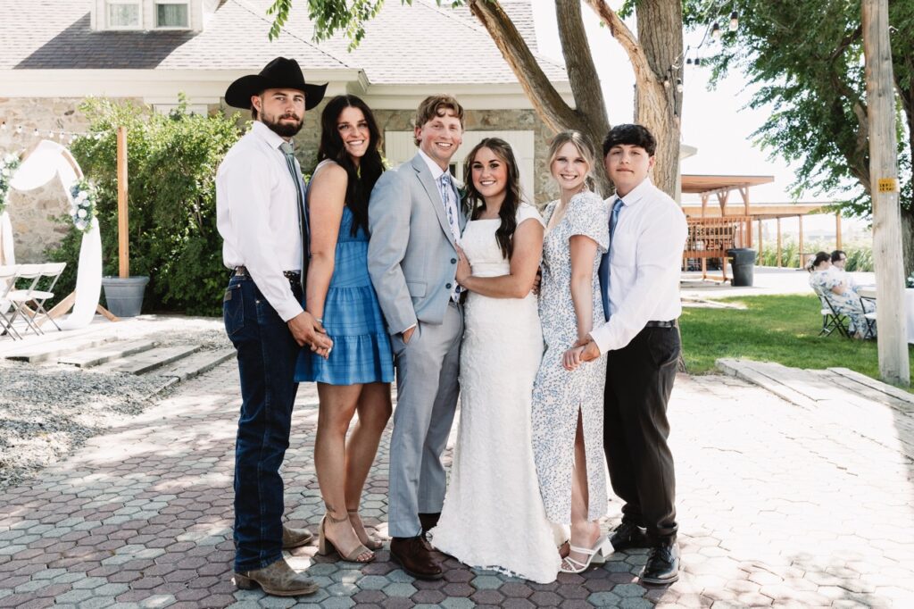 Wedding Guest with Bride & Groom | Mill Pond Farm Events | Spring Outdoor Wedding Utah | Outdoor Wedding Attire for Guests