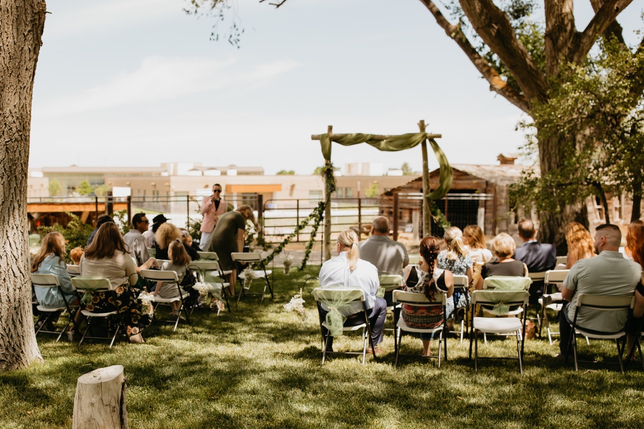 Guests Seated at Sunny Outdoor Wedding Ceremony | Unique Outdoor Wedding Aisle | Romantic Wedding Ideas for Outdoor Venues