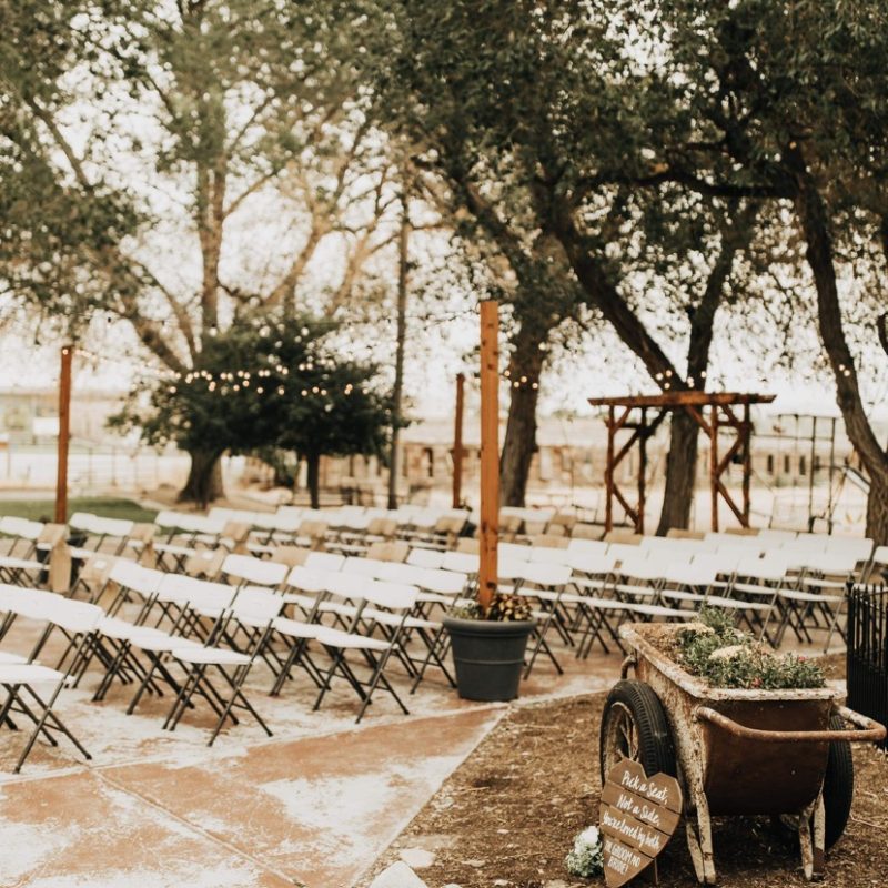 Outdoor Wedding Ceremony Setup of Chairs & Wedding Arbour w/ Trees Surrounding | Rustic Barn Wedding Venues in Utah | Affordable Wedding Venues in Utah | Mill Pond Farms Events