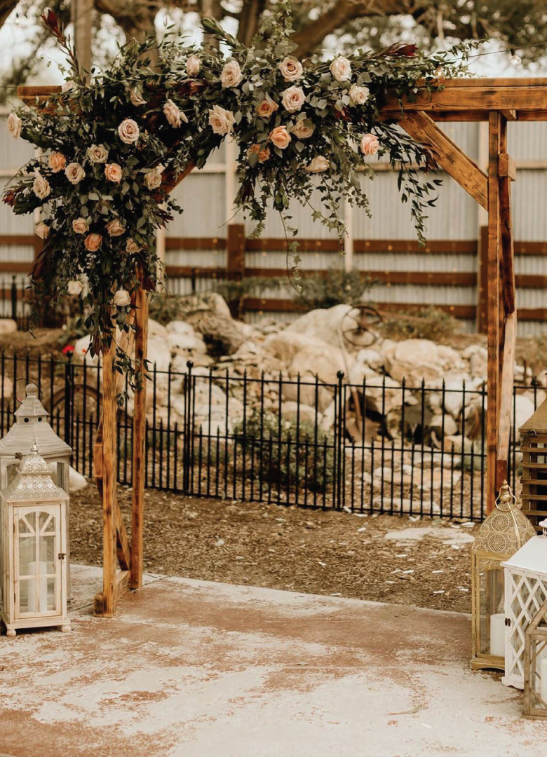 Outdoor Wedding Arch with Pink Florals | 10 Reasons Why Mill Pond Farms Events Center is an Incredible Barn Wedding Venue in Utah | Mill Pond Farms | Rustic Wedding Venues in Utah