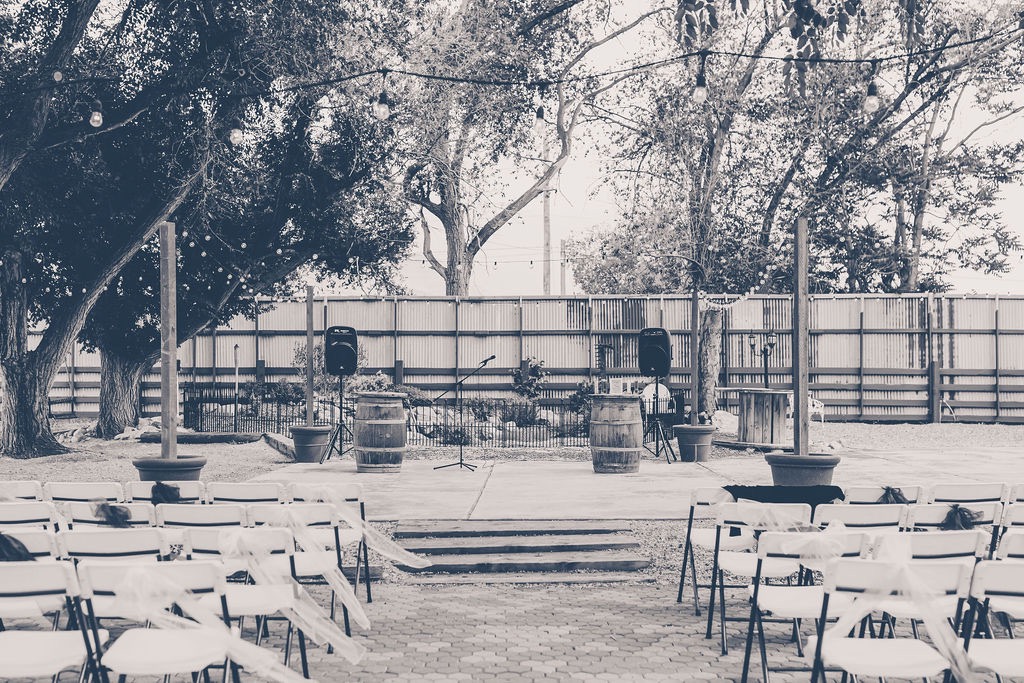 Chairs & Stage for Outdoor Wedding Reception in Black & White | Things To Remember When Planning a Wedding in Utah | Mill Pond Farms | Utah Wedding Vendor | Utah Wedding Planner