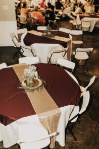 Brown & Gold Wedding Tables in Indoor Venue | Why Choosing a Wedding Venue with an Indoor & Outdoor Area is Essential | Mill Pond Farms | Indoor and Outdoor Ceremony | Essential Venue Ideas