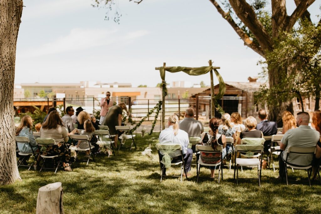 Guests Seated at Sunny Outdoor Wedding Ceremony | Unique Outdoor Wedding Aisle | Romantic Wedding Ideas for Outdoor Venues