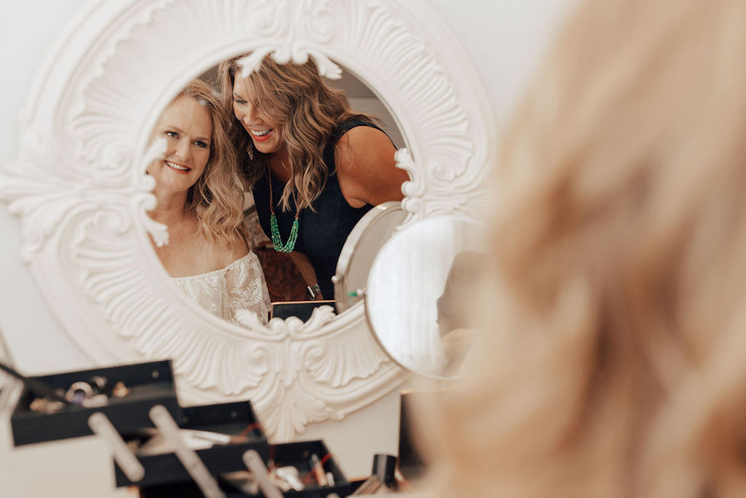 A Bride & a Guest in Bride's Room In Front of the Mirror | Inclusive Wedding Venues​ | Gatherings and Corporate Event Venues in Utah