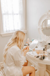 Bride Doing Makeup in the Mill Pond Farms Events Bridal Suite | Bride's Wedding Venue Amenities | All-Inclusive Wedding Venues